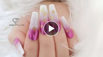Pink Christmas chrome ombre nails with gold snowflakes. Christmas nail art