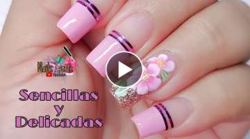 Decoración de uñas sencillas y delicadas en tono rosa con / diseño de uñas pinceladas o one s...